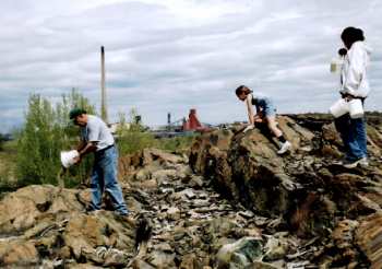 Clarence spreads limestone on barren area